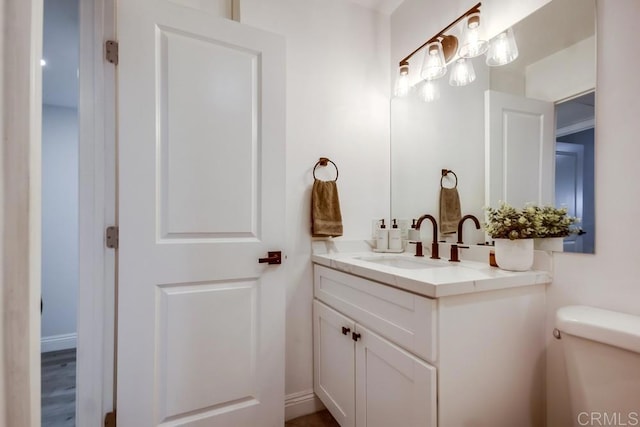 bathroom with vanity and toilet