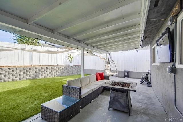 view of patio featuring an outdoor living space with a fire pit