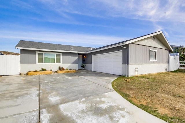 ranch-style house featuring a garage