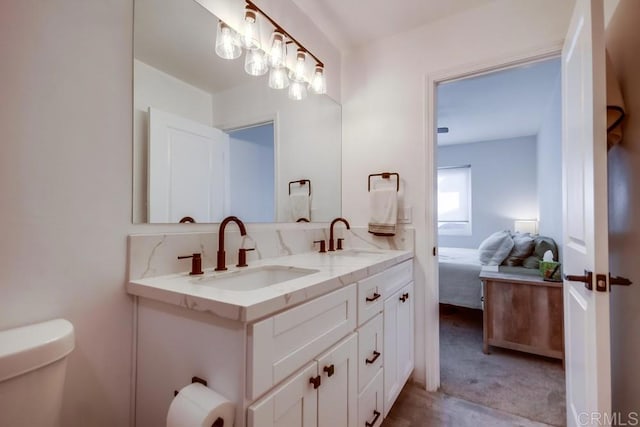 bathroom with vanity and toilet