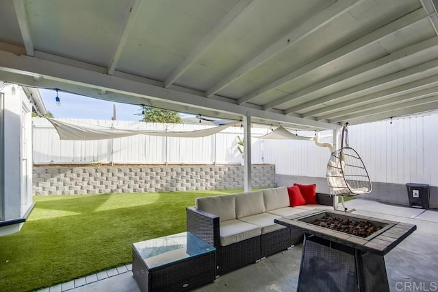 view of patio / terrace featuring an outdoor living space with a fire pit