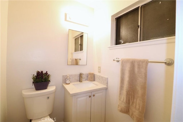 bathroom with vanity and toilet