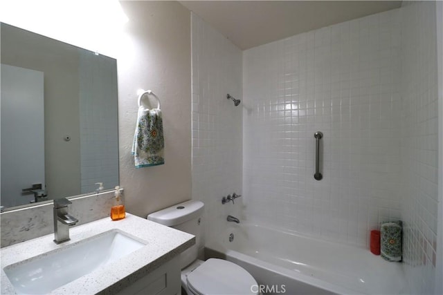 full bathroom with vanity, toilet, and tiled shower / bath combo