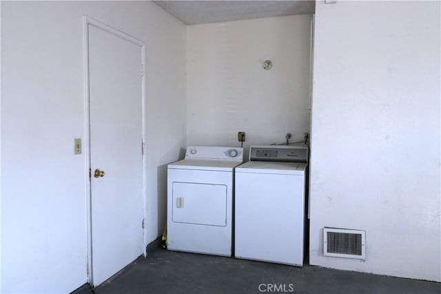 laundry area with washing machine and dryer