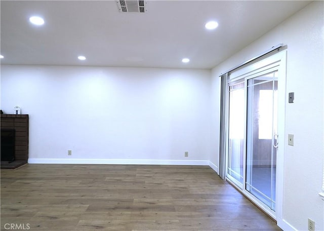 unfurnished living room featuring dark hardwood / wood-style flooring