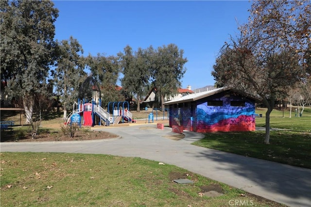 surrounding community featuring a lawn and a playground