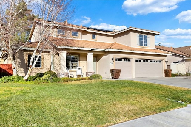 view of front of property featuring a garage, a front yard, and solar panels