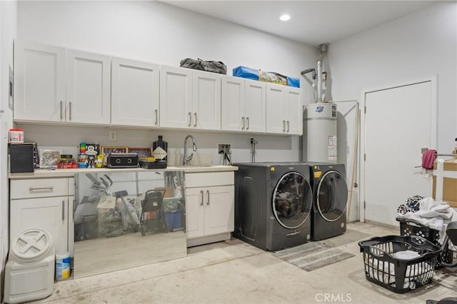 laundry room with cabinets, washing machine and dryer, sink, and secured water heater