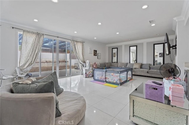 living room with light tile patterned floors, crown molding, and french doors