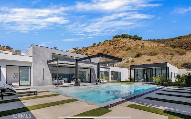 rear view of house featuring a patio