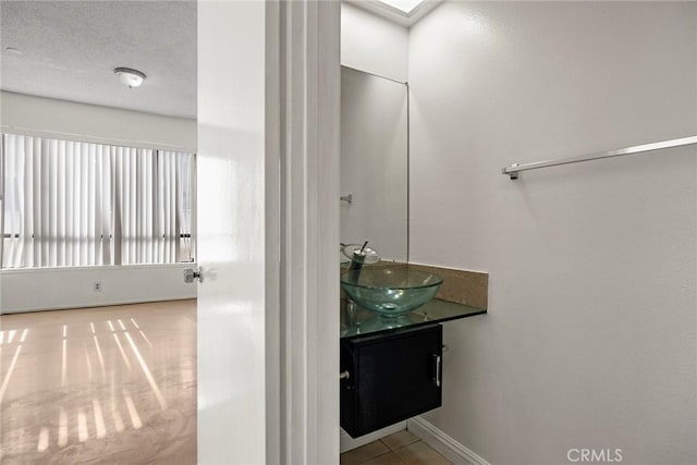 bathroom featuring vanity and a skylight