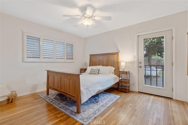 bedroom featuring access to exterior, ceiling fan, and light hardwood / wood-style flooring