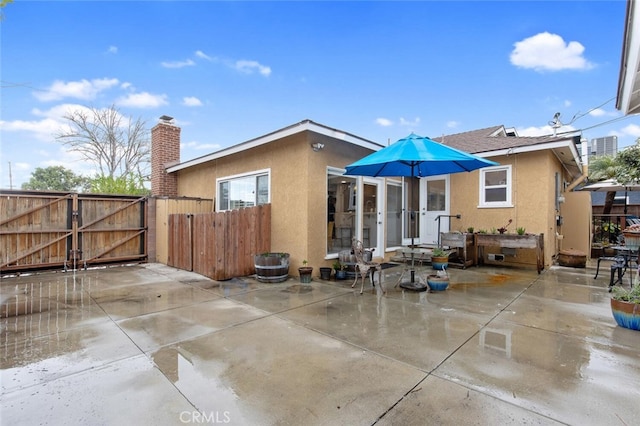 rear view of property with a patio area