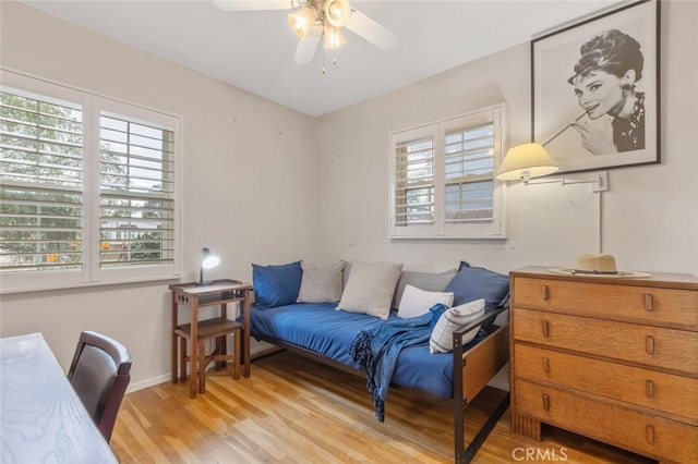 sitting room featuring light hardwood / wood-style flooring and ceiling fan