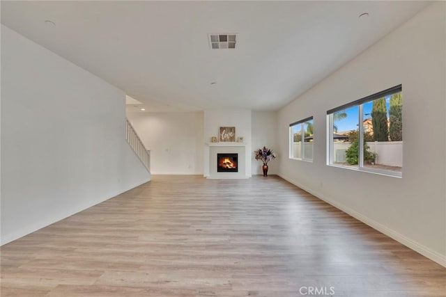 unfurnished living room featuring light wood-type flooring