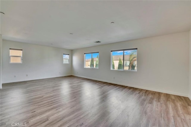 unfurnished room featuring light hardwood / wood-style flooring