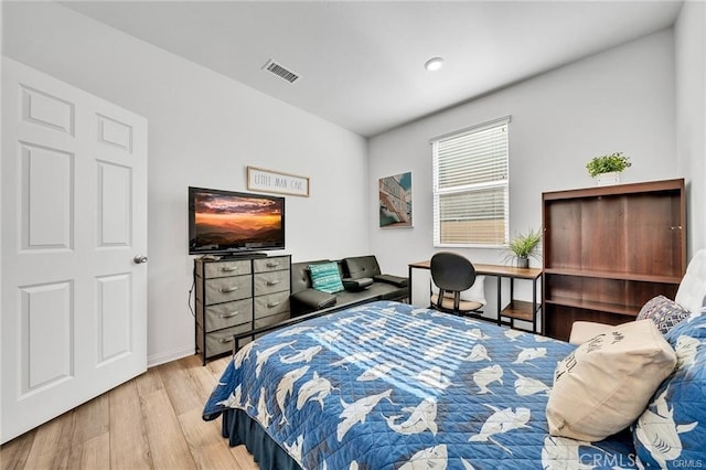 bedroom with light hardwood / wood-style floors