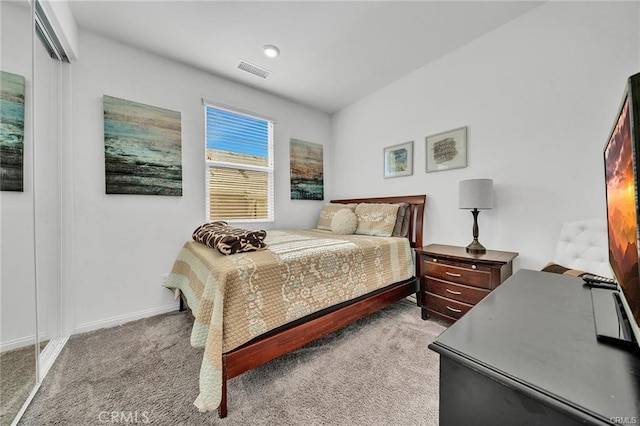 bedroom featuring light carpet