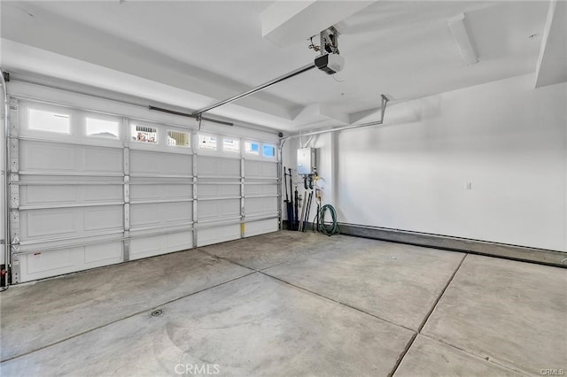 garage featuring a baseboard heating unit, a garage door opener, and electric panel