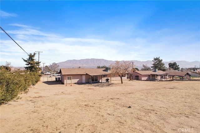 rear view of house with a mountain view