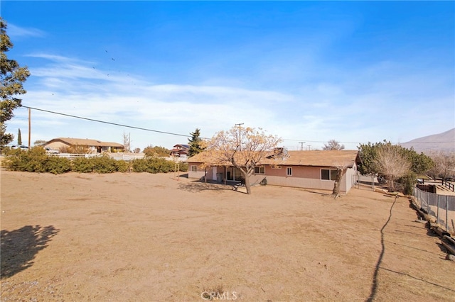 back of property with a mountain view