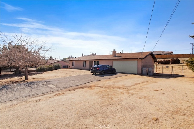 ranch-style home with a garage