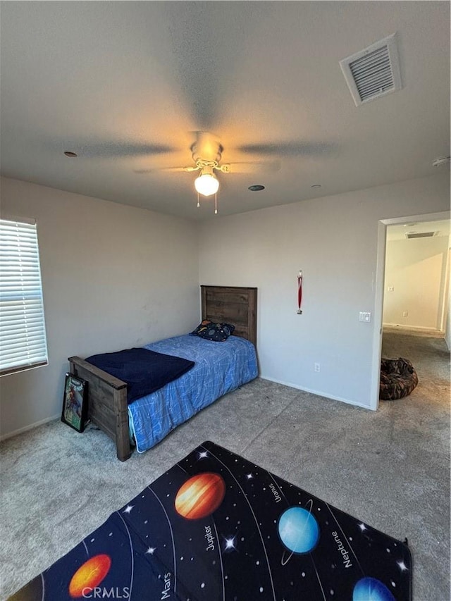 carpeted bedroom with ceiling fan