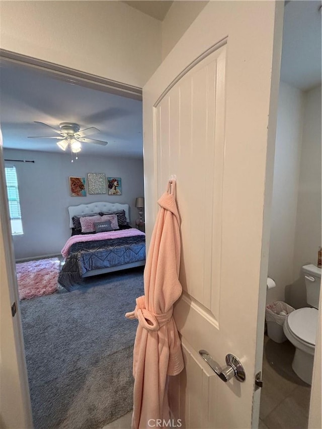 bedroom with carpet flooring, ceiling fan, and a closet