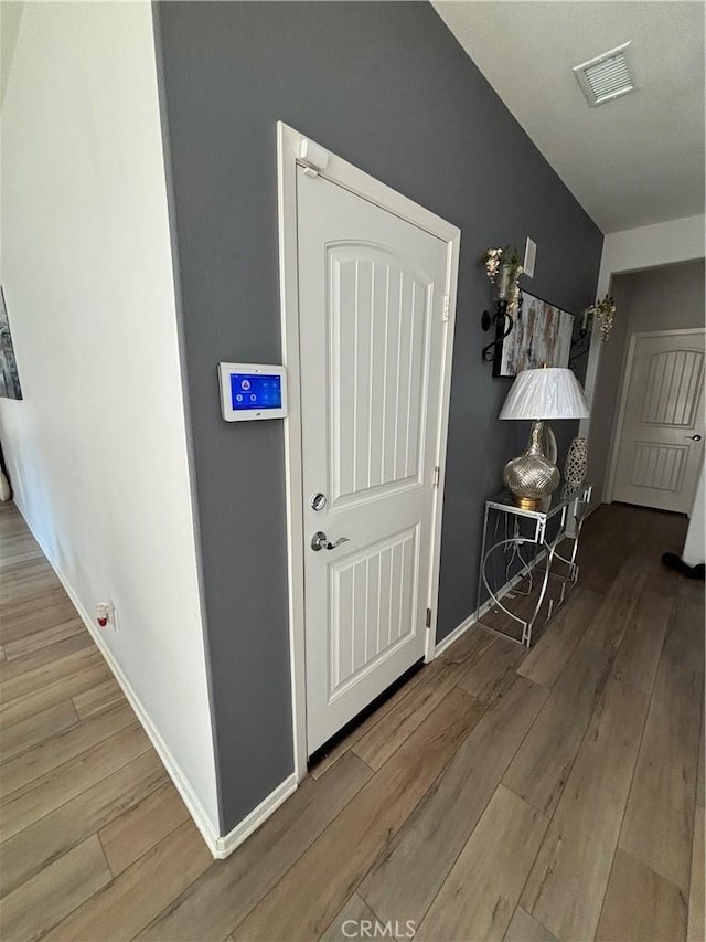 hallway featuring hardwood / wood-style floors