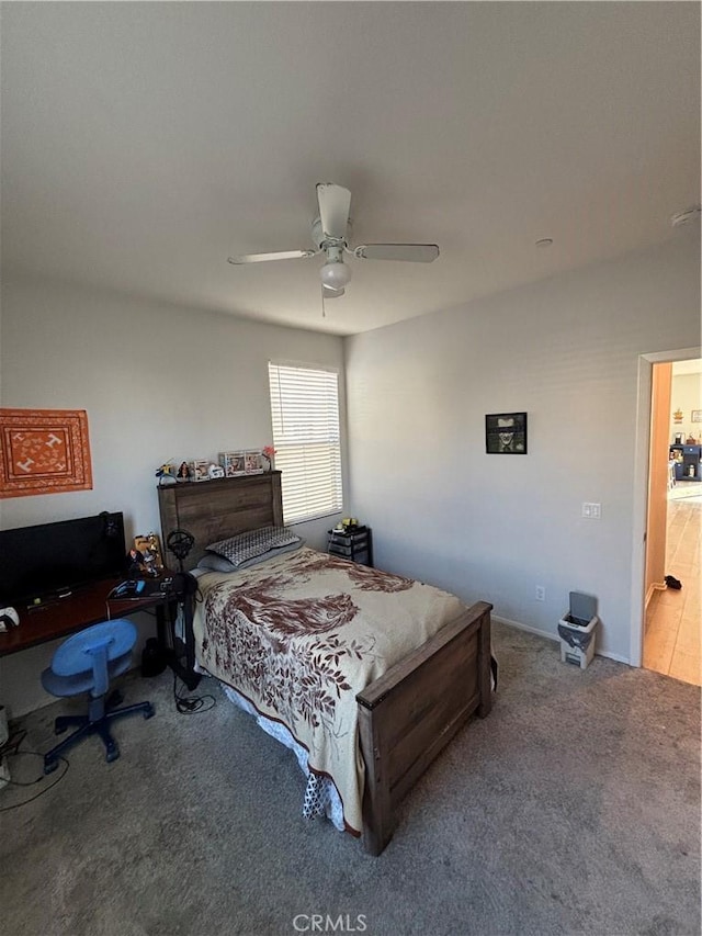 carpeted bedroom featuring ceiling fan