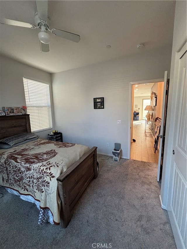 carpeted bedroom featuring ceiling fan