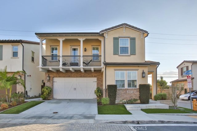 view of front of home with a balcony and a garage