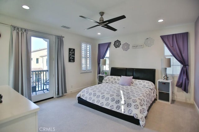 bedroom featuring ceiling fan, light colored carpet, and access to exterior