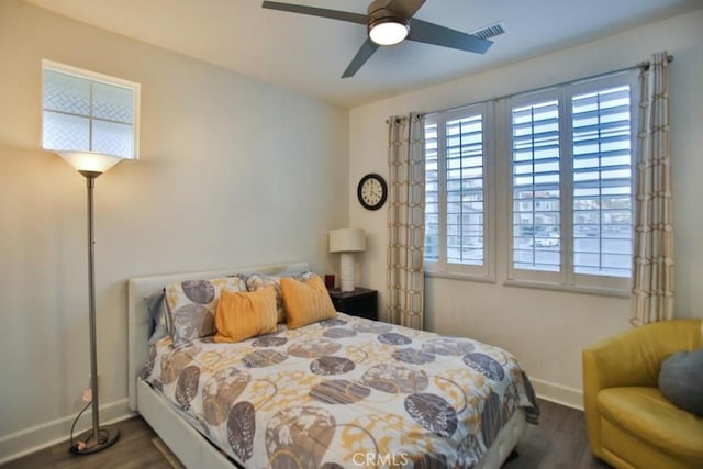 bedroom with dark wood-type flooring and ceiling fan