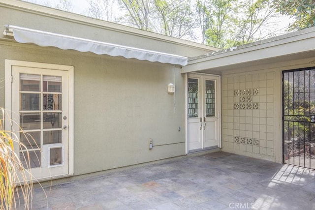 doorway to property featuring a patio