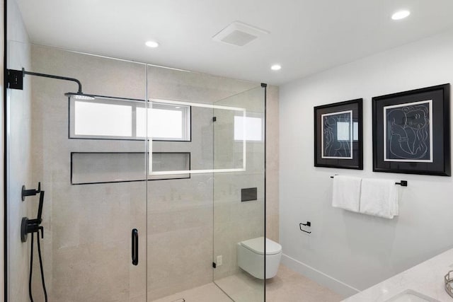 bathroom with vanity, tile patterned floors, toilet, and walk in shower