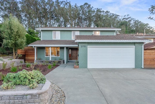 front of property featuring a garage and covered porch