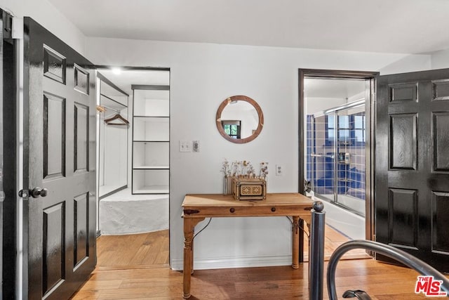 office with light hardwood / wood-style floors