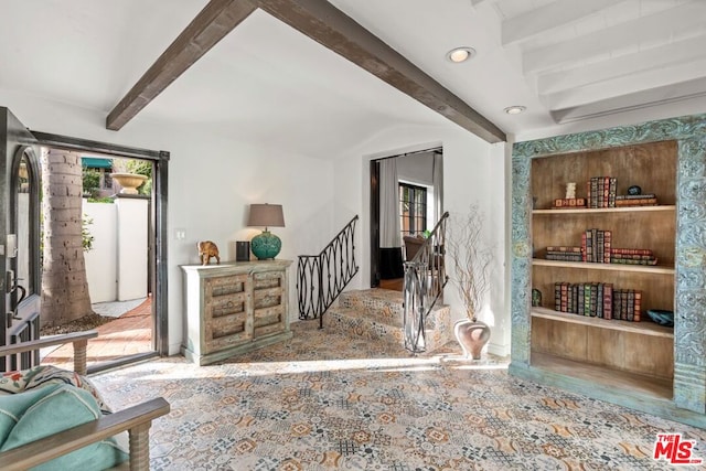 interior space with beam ceiling and built in features