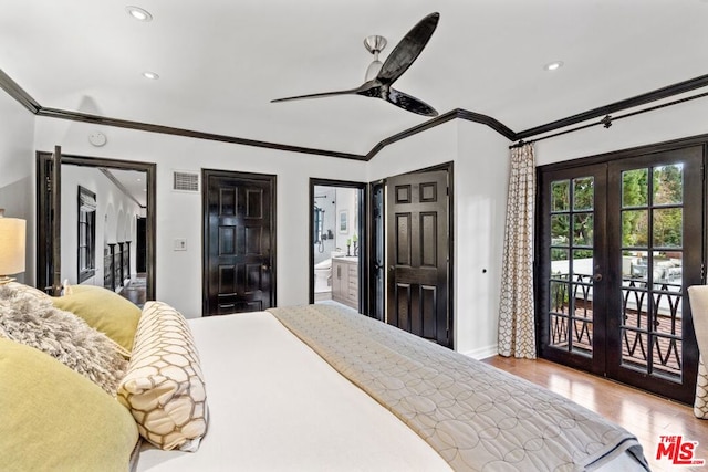 bedroom with access to exterior, light hardwood / wood-style floors, crown molding, ensuite bath, and french doors