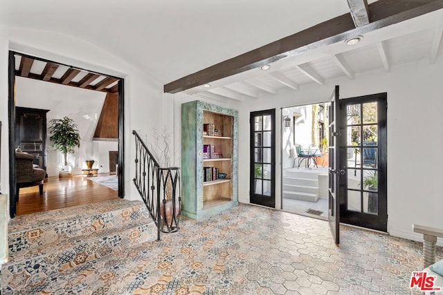 foyer with beam ceiling