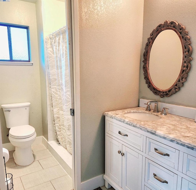 bathroom with vanity, tile patterned flooring, toilet, and a shower with shower curtain