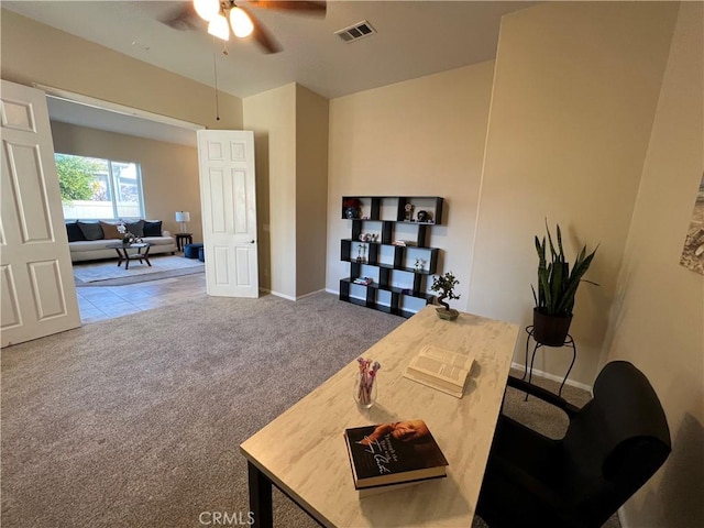 home office featuring ceiling fan and carpet