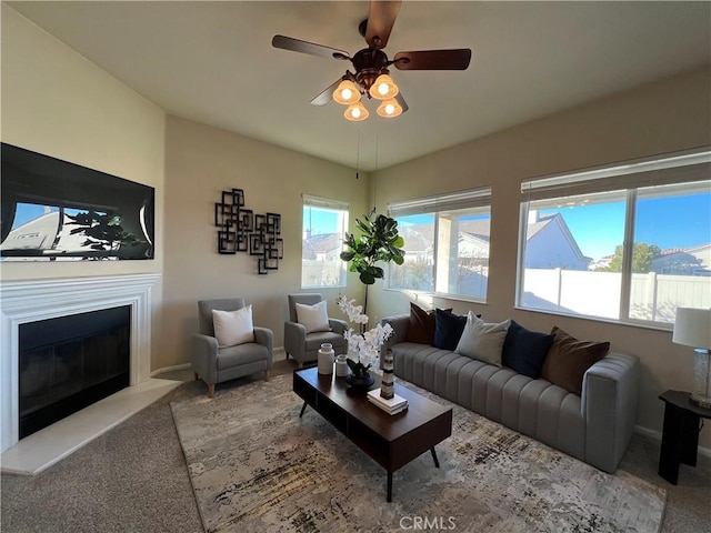 living room with ceiling fan and light carpet