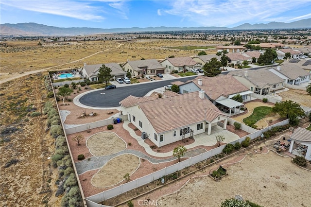 birds eye view of property with a mountain view