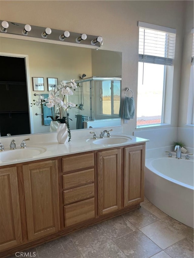 bathroom featuring vanity, tile patterned floors, and separate shower and tub