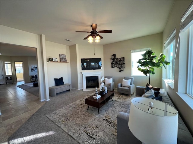 living room with plenty of natural light and ceiling fan