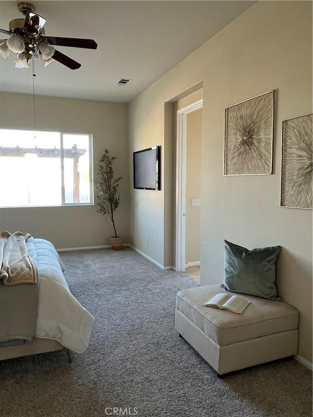 carpeted bedroom with ceiling fan