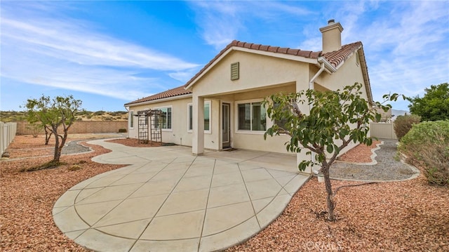 rear view of house featuring a patio