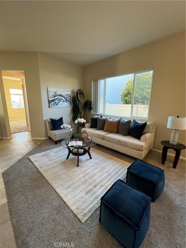 living room with tile patterned floors and plenty of natural light